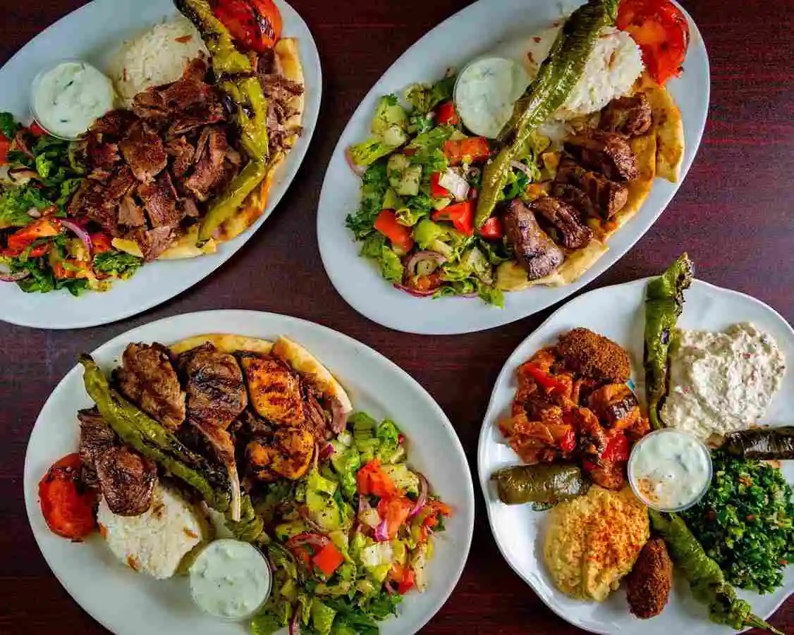 Four Plates with Mediterranean-style food, taken from above