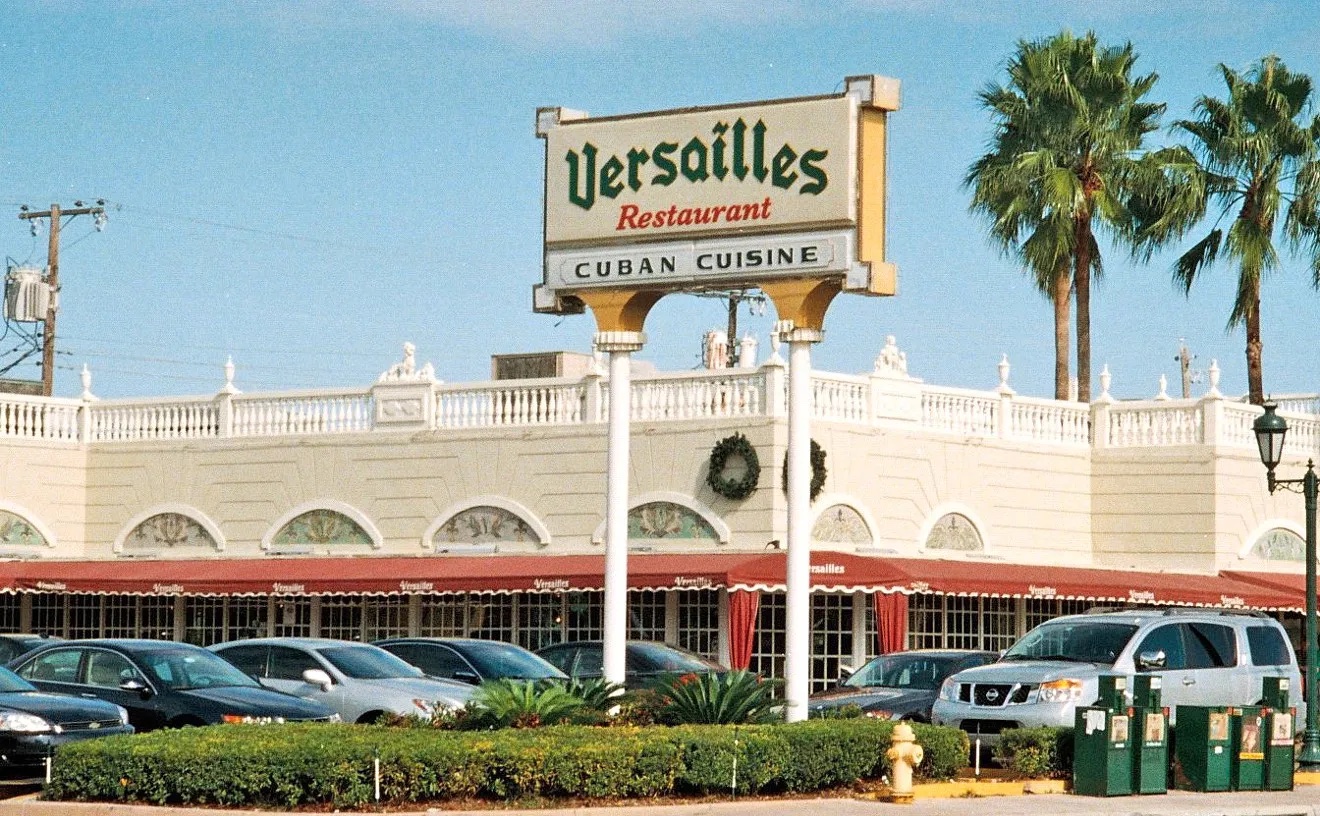 Exterior shot of Versilles Restaurant building and sign