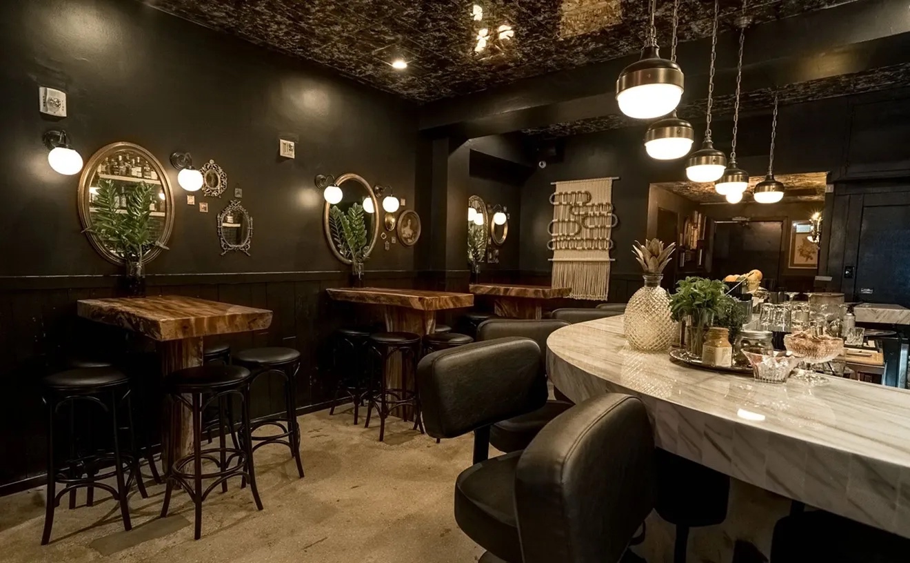 marble topped bar and leather backed bar stools