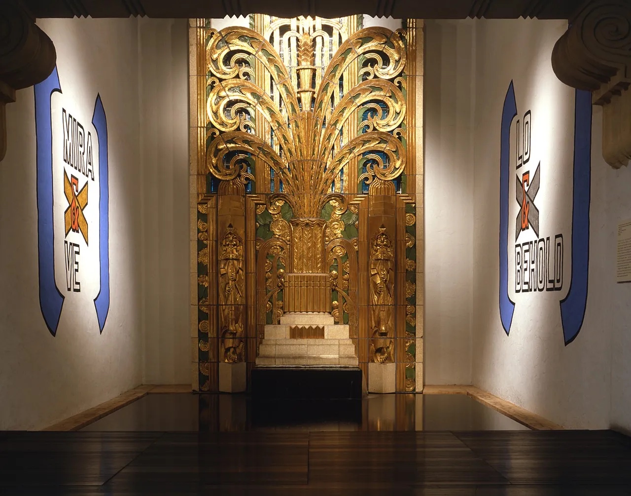 Interior of Wolfsonian Museum with an ornate golden relief in art deco style